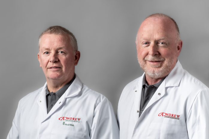 Two men in white Andrew Ingredients jackets